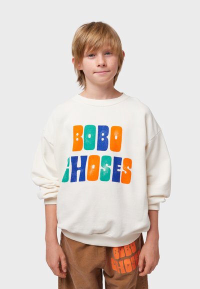 Sudadera blanca con letras en bloque multicolores "BOBO CHOSES" en naranja, verde, azul y turquesa. Suave, de corte holgado; puños acanalados.