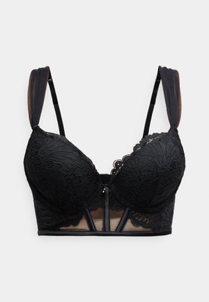 Soutien-gorge en dentelle noire avec bonnets rembourrés, bords festonnés et bandes en maille transparente. Doté d'un ornement décoratif au centre avant et de bretelles réglables.