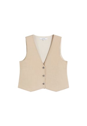 Chaleco sin mangas beige con escote en V y tres botones metálicos decorativos en la parte delantera, corte entallado, etiqueta visible en el interior del cuello.