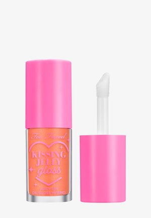 A pink tube of lip gloss with a frosted orange color, featuring a star pattern and a white applicator wand. Embossed branding on the bottle.
