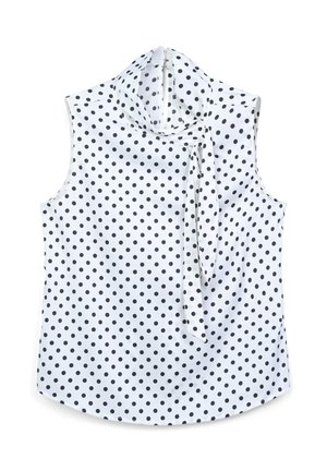 Blouse sans manches en tissu blanc avec des pois noirs. Dotée d'un col montant et d'une section nouée au niveau du cou. Texture lisse, ourlet arrondi.