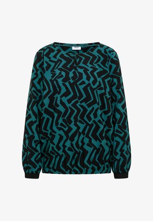 Langærmet bluse i teal og sort med abstrakt zigzag-mønster; har en rund halsudskæring og elastiske manchetter med rynker nederst.