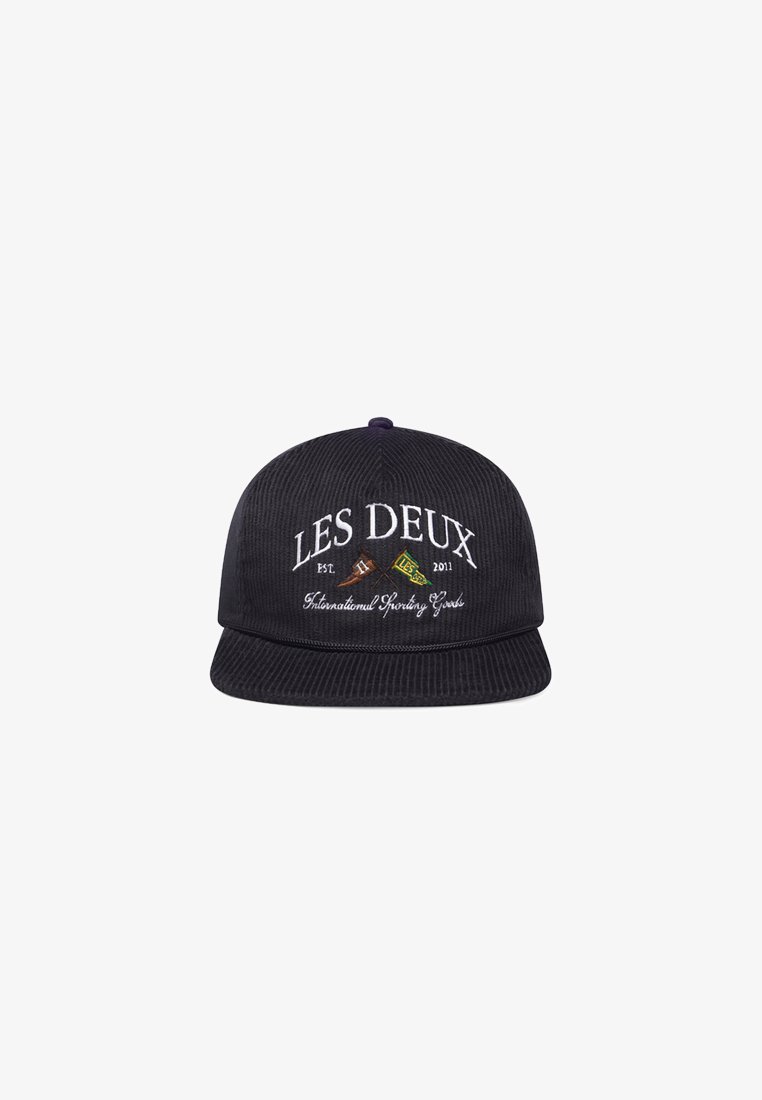 Black corduroy cap with a flat brim, embroidered text "LES DEUX" and graphics in contrasting colors, featuring textured fabric.