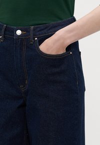 ONLY Tall ONLJUICY WIDE RINSE  - Wide leg - dark blue denim