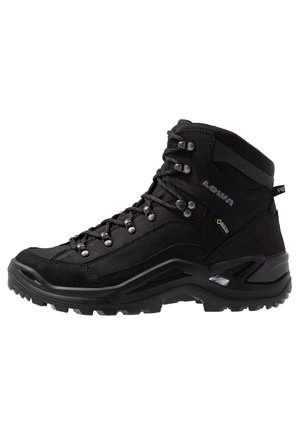 Black high-top hiking boot made of suede and synthetic material. Features metal eyelets, reinforced toe, textured sole, and waterproof membrane.