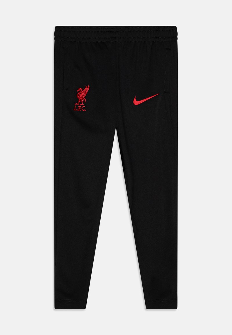 Pantalon de sport noir en tissu léger, avec le logo rouge de Liverpool FC et le swoosh rouge de Nike sur la cuisse gauche. Ceinture élastique.