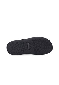 Black rubber sole with a textured grid pattern, featuring a durable, smooth surface and a logo embossed in the midsection.