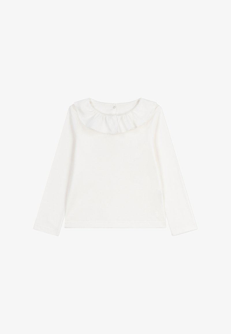 Weißes Langarmoberteil mit einem Rüschensaum, weichem Baumwollstoff und einer Knopfschließe im Rücken. Einfaches und leichtes Design.