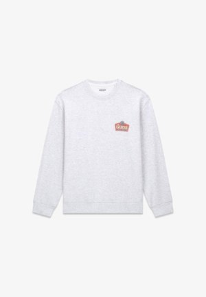 Szara bluza z długimi rękawami, ściągaczami na mankietach i u dołu. Na piersi małe czerwono-szare logo. Wykonana z mieszanki bawełny.