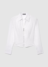 White, long-sleeve shirt with a collared neckline, cropped design, and front zipper. Smooth texture with subtle stitching details.