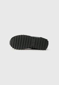 Black shoe sole with horizontal ridges and the brand name "ALLSAINTS" and size "37" embossed in the center.