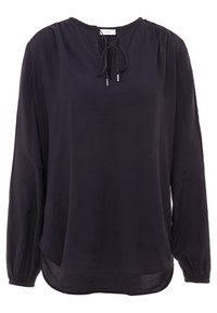 Blouse bleu marine foncé à manches longues, col rond, avec un détail noué à l'avant. Épaules légèrement froncées et ourlet courbé.