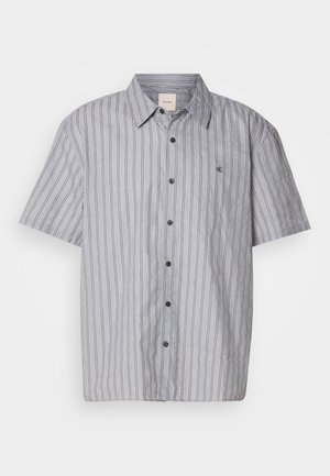 Short-sleeve, button-up shirt made of lightweight fabric with blue and white vertical stripes. Features a classic collar and front pocket.