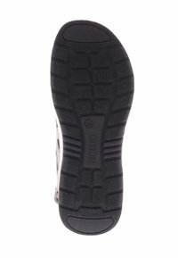 Zwarte rubberen zool met gestructureerde loopvlak voor grip, met het reliëfmerk "FIDELIO" en maat 38 op de onderkant.