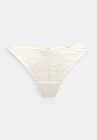 Στρινγκ δαντέλα σε ελεφαντόδοντο με σχέδια λουλουδιών, απαλό υφασμάτινο υφή και λείο ελαστικό παντελόνι για άνεση.