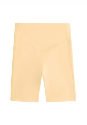 Shorts sportivi giallo chiaro con vita alta, trama liscia e linee pulite. Presentano un design senza cuciture e una lunghezza corta.