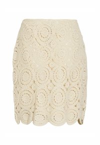 Jupe en dentelle au crochet en blanc cassé, avec des motifs circulaires, un ourlet festonné et une coupe ajustée, fabriquée en tissu texturé.
