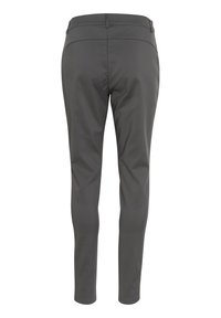 Pantalons gris slim fit en tissu lisse. Présentent un devant plat, une couture de dos et pas de poches visibles. Design ajusté.