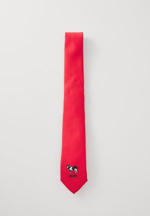 Red fabric tie featuring a black and white cow graphic with "MOSCHINO" text at the bottom. Smooth texture and classic narrow shape.