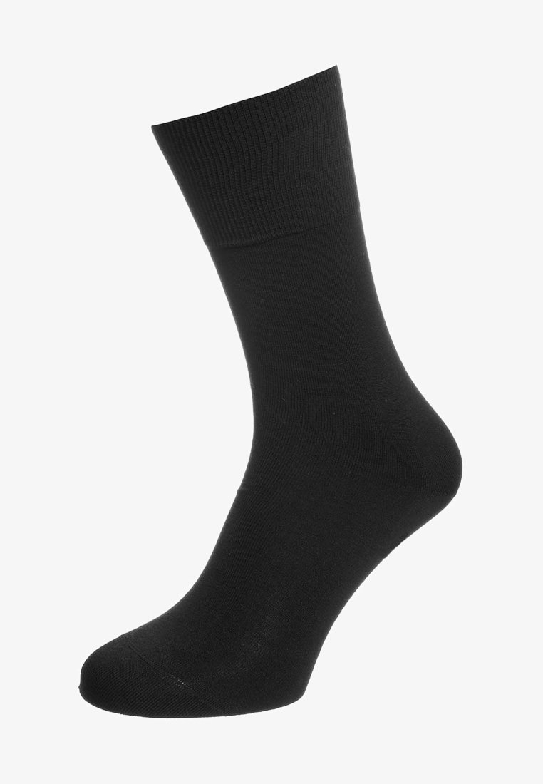 Sort bomuldssok med ribbet skaft og glat tekstur. Har et ankelhøjt design, der er velegnet til både casual og formel påklædning.