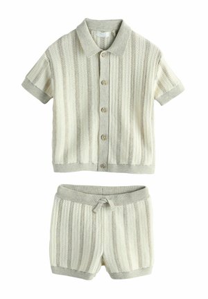 Short-sleeve buttoned knitted cardigan and matching knitted shorts set in light beige with textured vertical stripes.