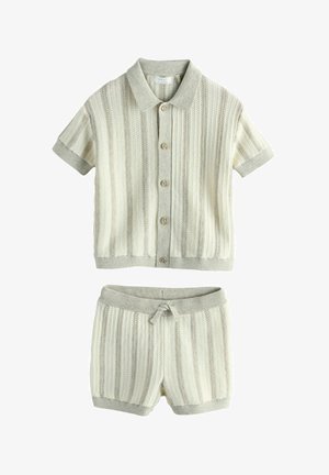 Short-sleeve buttoned knitted cardigan and matching knitted shorts set in light beige with textured vertical stripes.
