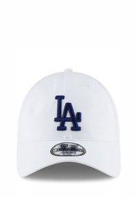 Weißer Baseball-Cap mit einem dunkelblauen "LA"-Logo, das auf der Vorderseite aufgestickt ist. Verfügt über einen gebogenen Schirm und ein verstellbares 9TWENTY-Design.