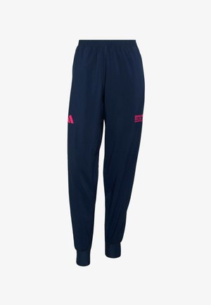 Pantaloni della tuta blu navy con fascia elastica in vita, polsini a costine e dettagli con logo e testo rosa. Realizzati in tessuto leggero e liscio.