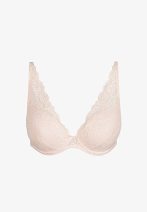 Lichtroze kanten bh met een diepe halslijn, bloemenpatroon, golvende randen en een klein strikje in het midden. Glad materiaal.