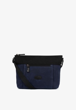 Granatowo-czarna torba na ramię z przednią kieszenią na zamek, regulowanym czarnym paskiem oraz minimalistyczną naszywką z logo na materiałowej powierzchni.
