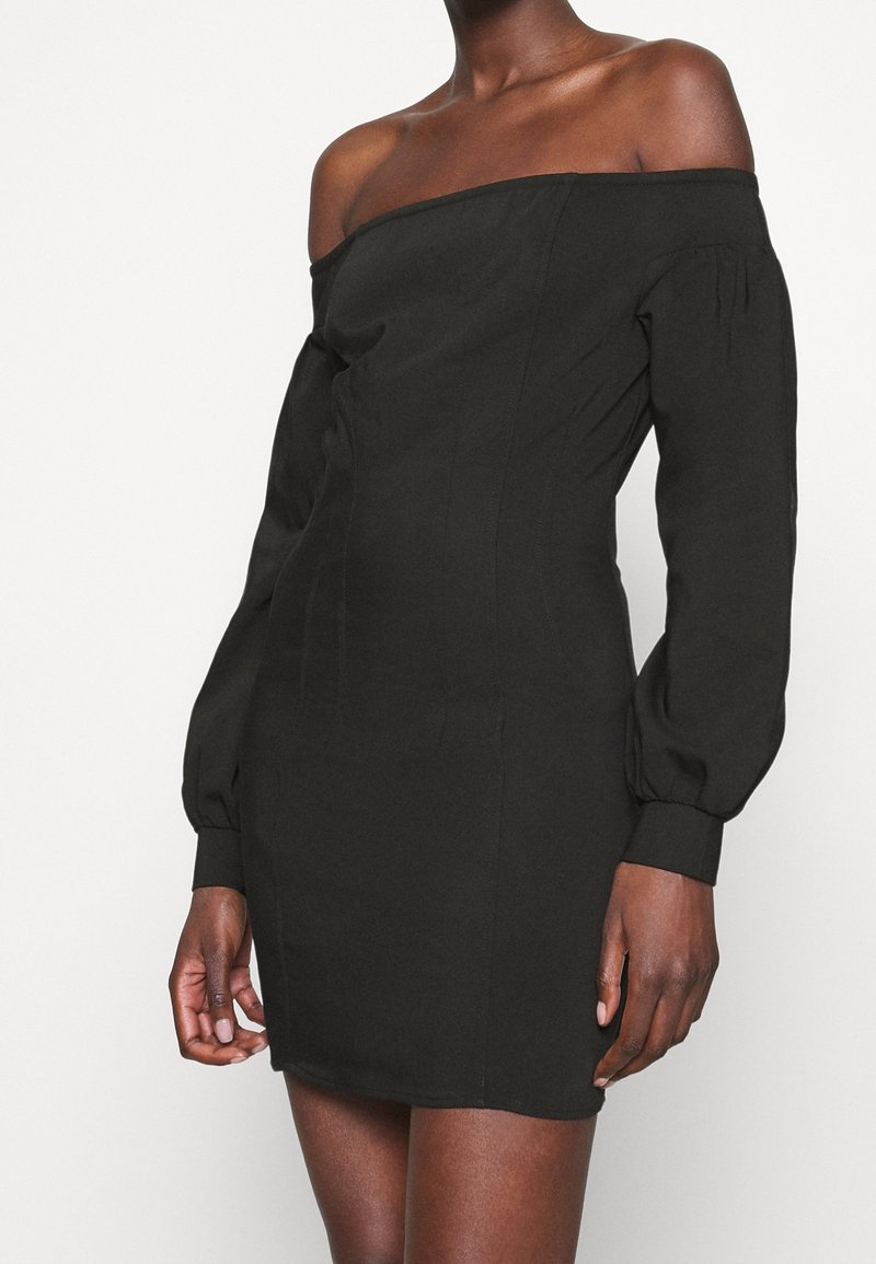 Black off-shoulder dress with long puff sleeves, fitted bodice, and straight skirt. Made from a smooth fabric with a solid color.