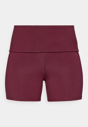 Burgundijas īsie legingi ar platu jostasvietu, izstrādāti komfortam; gluda tekstūra, minimāla šūšana un bez redzamām rotājumam.