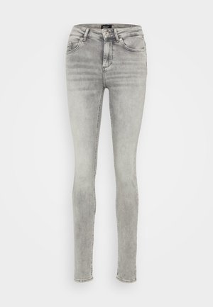 Grå spissbukser laget av denim med en falmet finish. Har fem lommer, beltehemper og glidelås med knapplukking.
