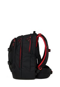 Black backpack with multiple zippered compartments, red accents, padded shoulder straps, and a hip belt, shown from side view.