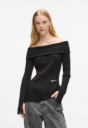 Czarny top z dekoltem off-the-shoulder, wykonany z prążkowanej dzianiny, z długimi rękawami, posiadający szeroki dekolt i logo Karl Lagerfeld Jeans na dolnym końcu.