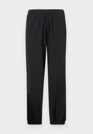 Pantalon de survêtement noir avec une ceinture élastique, un cordon de serrage réglable, des jambes effilées et des poignets élastiques. Confectionné dans un tissu doux et lisse.