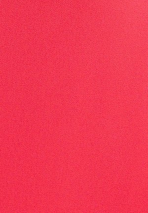 Surface texturée d'un rose vif uni avec de petites bosses surélevées uniformes couvrant toute la zone.