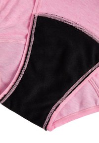 Rosa bomullstyg kombinerat med en svart panel, med kontrasterande rosa stygn längs kanterna och en slät yta.