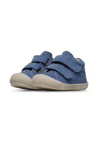 Blue denim children's shoes with two Velcro straps, rounded toe, and textured beige rubber sole. Features stitched detailing and a low profile.
