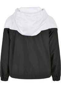 Svart och vit huva jacka i ett lätt material. Har en mesh-fodrad huva och elastiska cuffs. Ren, färgblockerad design.