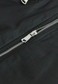 Next COATED ZIP - A-linjainen hame - black