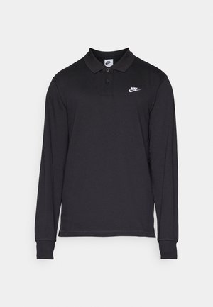 Polo de manga larga negro hecho de una mezcla de algodón y poliéster. Presenta un cuello clásico, tapeta de botones y un logo de Nike en blanco en el pecho.