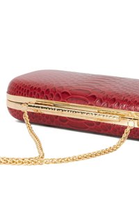 Red textured clutch bag with a faux snake print design, featuring gold hardware and a detachable chain strap. Rectangular shape.
