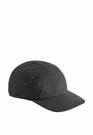 Black cap made of cotton with a flat brim, featuring stitched detailing and two ventilation holes on the sides. Simple and functional design.