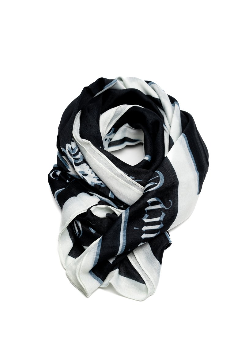 Sciarpa bianca e nera con un mix di motivi solidi e strisce. Tessuto morbido, texture leggera e design casual e drappeggiato.
