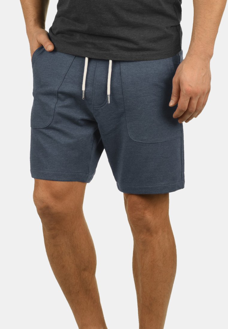 Men's blue shorts made of soft fabric. Features two front pockets, elastic waistband with drawstring, and a relaxed fit.