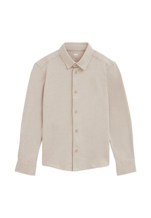 Chemise beige à manches longues, boutonnée, avec col et texture subtile à rayures diagonales, posée à plat sur fond blanc.