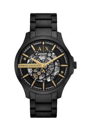 Zwart metalen Armani Exchange polshorloge met goudkleurige wijzers en markers, skelet-wijzerplaat die de mechanische beweging toont, en automatische label.