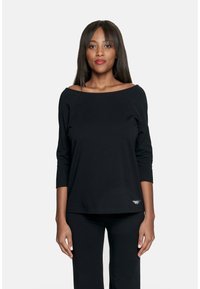 Czarny długi rękaw, top bez ramion wykonany z miękkiego materiału. Posiada luźny krój i mały haftowany detal na dole.