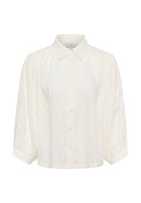 Chemise blanche à boutons avec col, manches bouffantes et motif en zigzag texturé. Réalisée en tissu léger.
